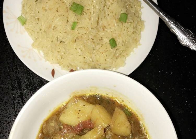 Spiced orange rice with meat and potatoes pepper soup