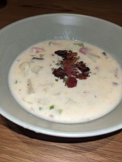 A picture of Creamy loaded ham and potato soup with bacon.