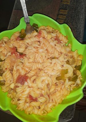 A picture of Italian pasta in red sauce.