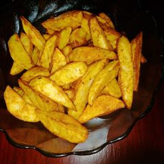 A picture of Baked potato wedges.