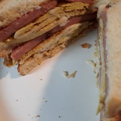 A picture of Folded Browned Folded Eggs with Spam Sandwich.