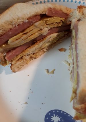 A picture of Folded Browned Folded Eggs with Spam Sandwich.