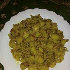 A picture of Boiled potatoes in egg.