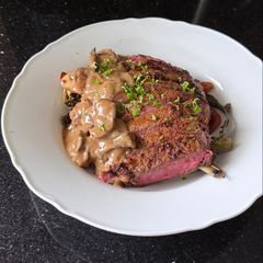 Rib Eye Steak with Wild Mushroom Sauce and Roasted Vegetables A picture of Rib Eye Steak with Wild Mushroom Sauce and Roasted Vegetables.