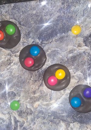 A picture of Dark chocolate with gems.