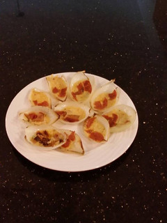 A picture of Pan Roasted Cheese Filled Onion Petals with Bacon a6nd Pepperoni.