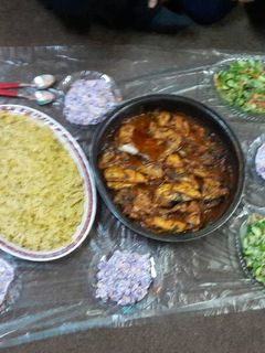 صورة لوصفة جاج مع خل وليمون وتوم مدخن.ورز بالبرتقال😋