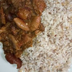 A picture of Ofada rice with sauce.