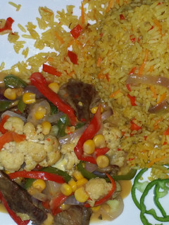 A picture of Rice with shredded beaf sauce.