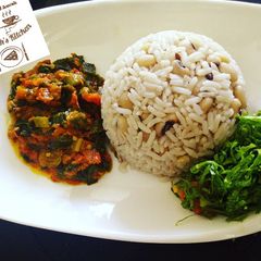 A picture of Rice and beans with sauce.