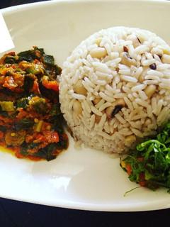 A picture of Rice and beans with sauce.