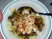 A picture of salad with jalapeno and olives
