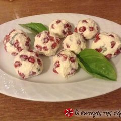 A picture of Truffles with cheese and pomegranate.