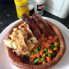A picture of Bangers and mash in a giant yourkshire.