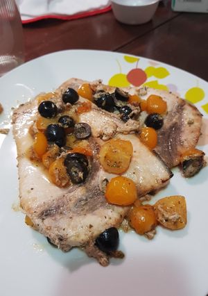 A picture of Swordfish with Cherry Tomatoes and Olives.