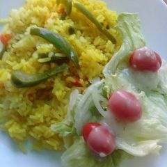 A picture of Savoury rice with green salad.