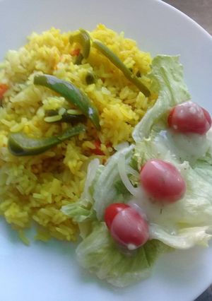 A picture of Savoury rice with green salad.