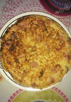 Una foto de Tortilla de arroz con panchos