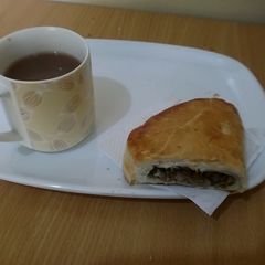 A picture of Meat Pie with hot chocolate.