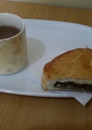 A picture of Meat Pie with hot chocolate.
