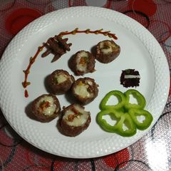 A picture of Cheese red rice with open balls.