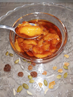 Una foto de Nísperos caramelizados