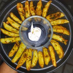 A picture of Crispy potato wedges.