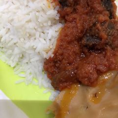 A picture of Moi moi and stew with rice.