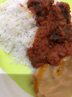 A picture of Moi moi and stew with rice.