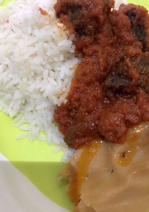 A picture of Moi moi and stew with rice.