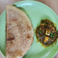 A picture of Brown rice mix lentils dosa with aalu matar korma.