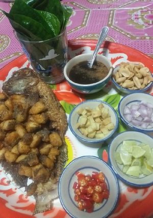 A picture of Miang Kham with Tilapia.