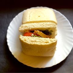 A picture of Basil pesto, grilled chicken in ciabatta.