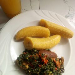 A picture of Boiled plantain and vegetable sauce.