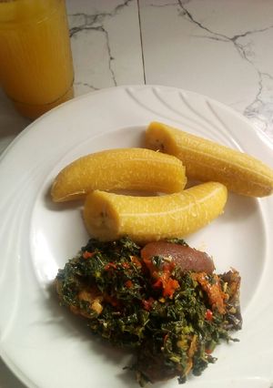 A picture of Boiled plantain and vegetable sauce.