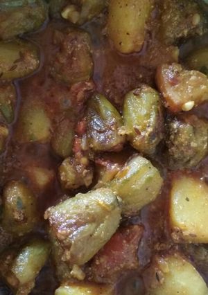 A picture of Potato parwal curry (aloo potoler dalna).