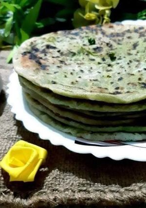 A picture of Karaishutir Parota, hungcurd/ Green peas stuffed bread with hungcurd.