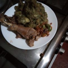 A picture of Kienyenji chicken with soup.