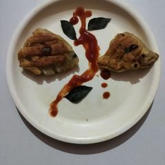 A picture of Paneer stuffed semolina samosa.