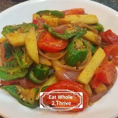 A picture of Sautéd potato, young chilli and tomatoes 地三鲜.