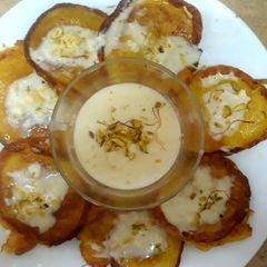 A picture of Malpua with rabdi(sweet pancake with sweet cream)EID MUBARAK 😊.