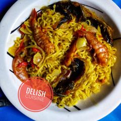 A picture of Noodles and dry fish with prawns.
