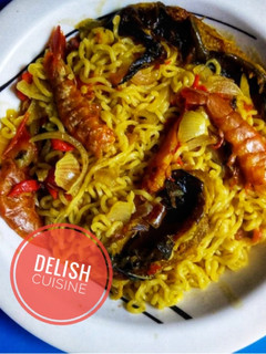 A picture of Noodles and dry fish with prawns.