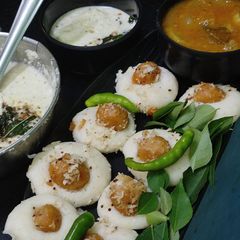 Mini Ammini kozhukattai stuffed idli with chutney&Sambar A picture of Mini Ammini kozhukattai stuffed idli with chutney&Sambar.