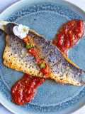 Pan fried sea-bass with spicy nam pla prik dipping sauce