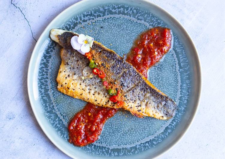 Pan fried sea-bass with spicy nam pla prik dipping sauce