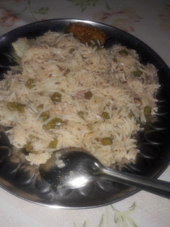 A picture of Green chana and potato pulao.