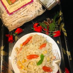A picture of Linguine white sauce pasta.
