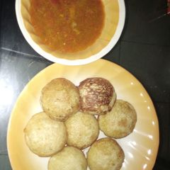 A picture of Semolina masa with chicken pepper soup.
