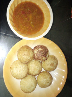 A picture of Semolina masa with chicken pepper soup.